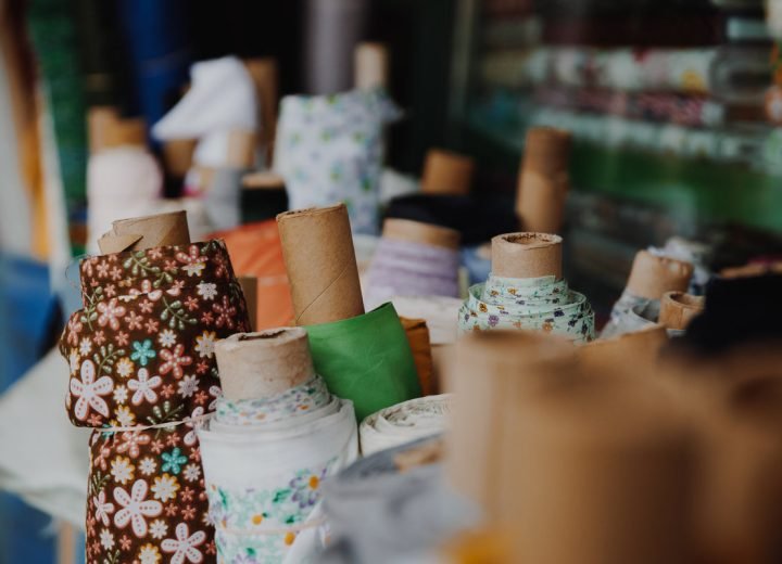 Rolls of fabric standing ready for cutting and supply