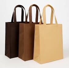 Three gusseted non-woven shopping bags in dark brown, brown and tan