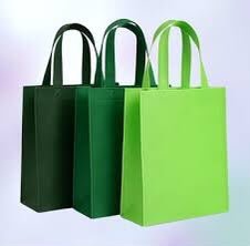 Three gusseted non-woven shopping bags in dark green, green and lime