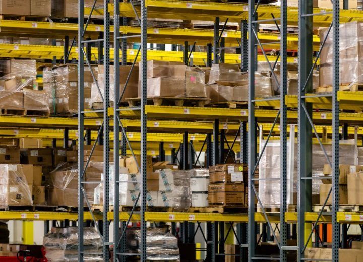 Packed cartons stored on high warehouse racking