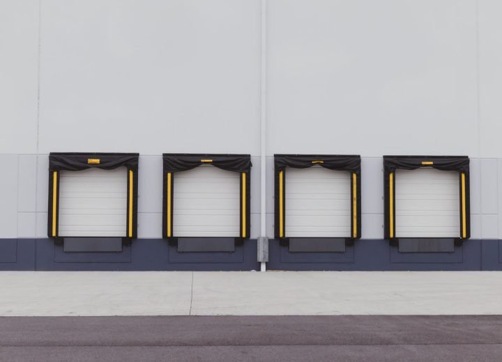 Row of clean loading bay doors at a distribution warehouse